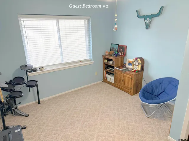 a bedroom with furniture and a window