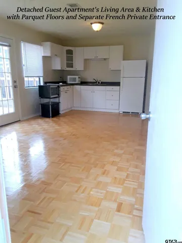 a large kitchen with kitchen island a sink stainless steel appliances and cabinets