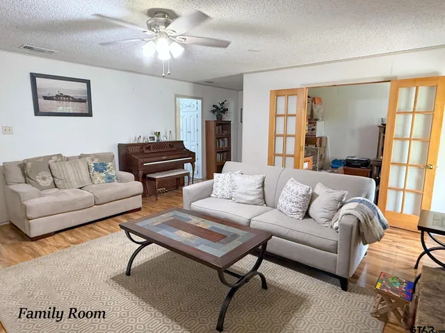 a living room with furniture and a window