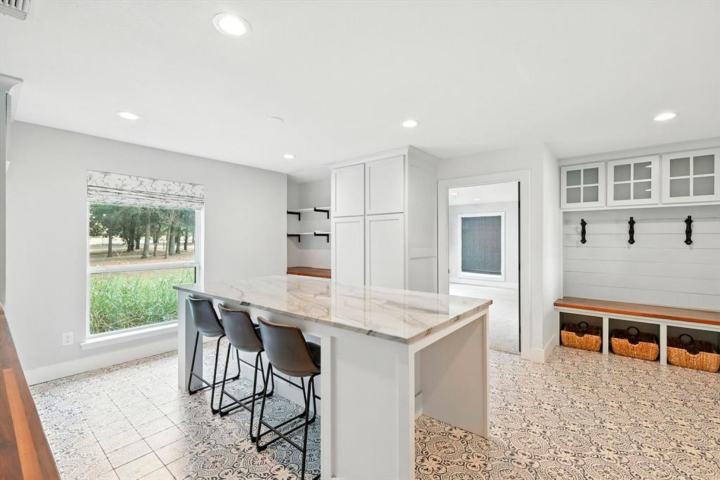 180 East Harpole Road Argyle, TX 76226 - Photo 13 of 38 a view of a dining room with furniture window and wooden floor