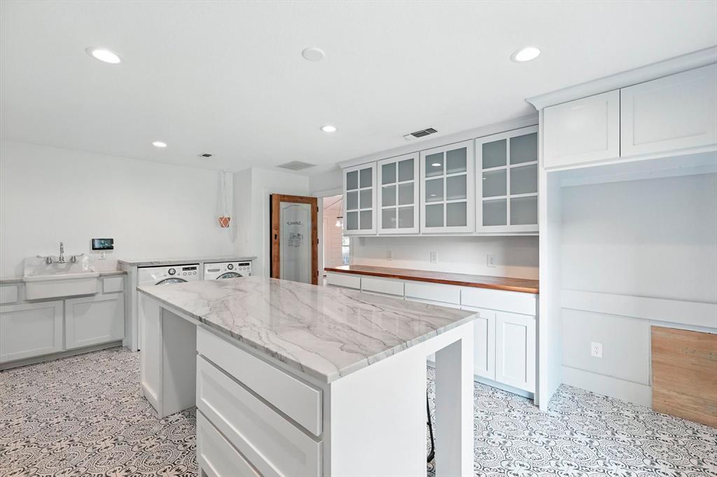 180 East Harpole Road Argyle, TX 76226 - Photo 14 of 38 a kitchen with a stove and a sink