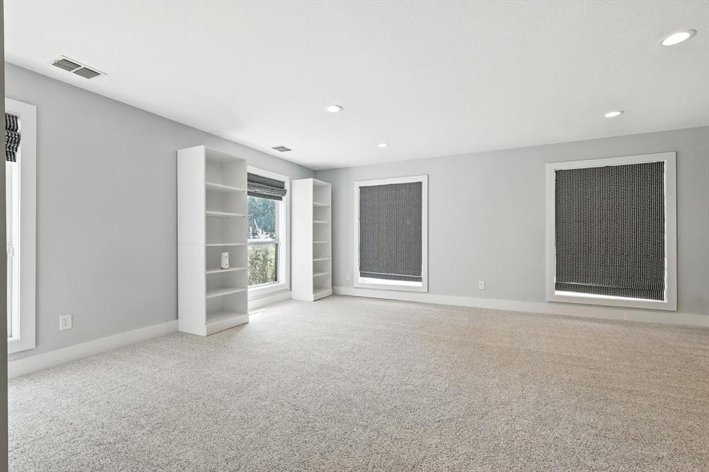 180 East Harpole Road Argyle, TX 76226 - Photo 25 of 38 a view of an empty room with closet and bathroom