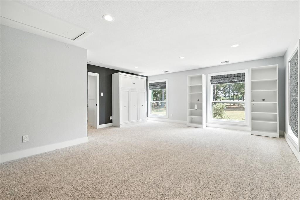 180 East Harpole Road Argyle, TX 76226 - Photo 27 of 38 a view of a big room with windows and chandelier fan