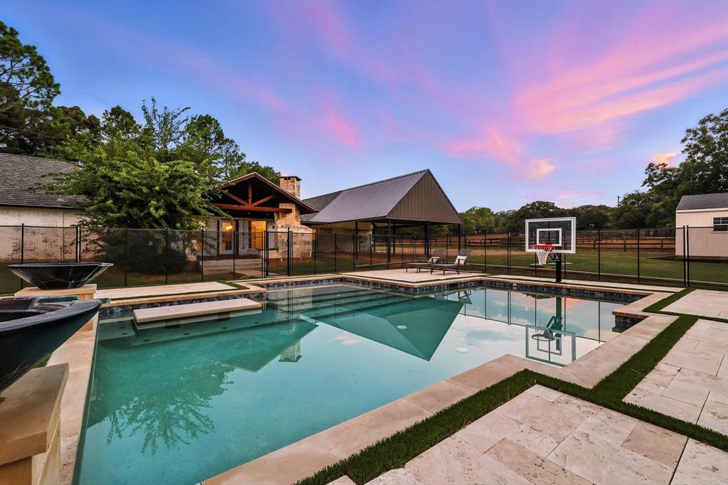 180 East Harpole Road Argyle, TX 76226 - Photo 29 of 38 a view of house with swimming pool outdoor seating