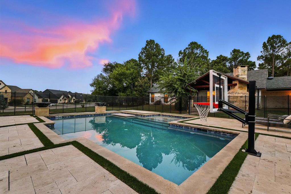 180 East Harpole Road Argyle, TX 76226 - Photo 32 of 38 a view of a swimming pool with a lounge chairs