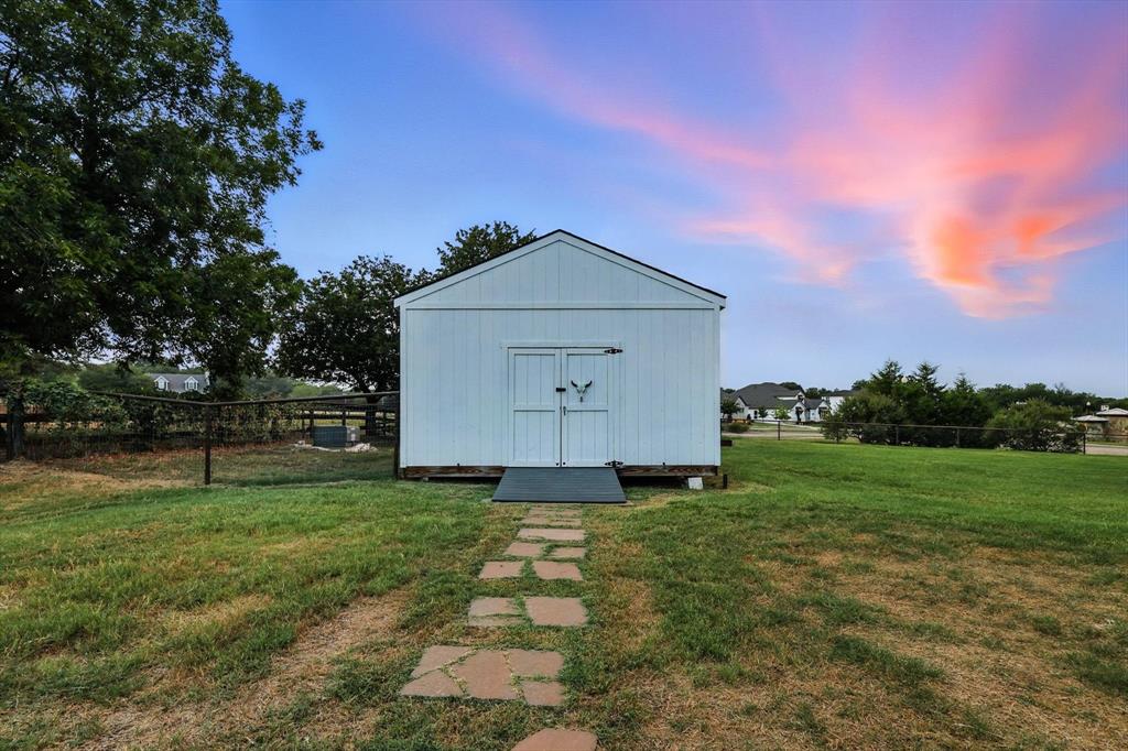 180 East Harpole Road Argyle, TX 76226 - Photo 34 of 38 a front view of a house with a yard