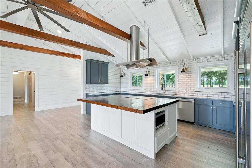 180 East Harpole Road Argyle, TX 76226 - Photo 10 of 38 a kitchen with stainless steel appliances granite countertop a sink and a stove
