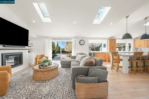 a bedroom with a bed and a chair with the outer view