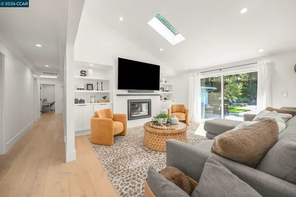 a bedroom with furniture and a wooden floor