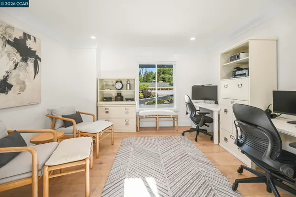 a bedroom with a bed and a table in it