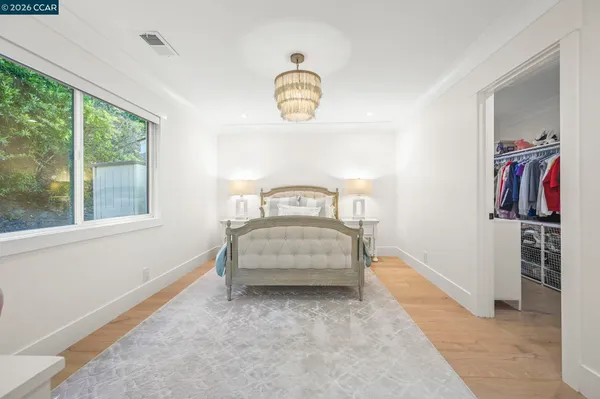 a bedroom with bed and window