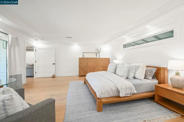a large bathroom with a double vanity sink a mirror and a bathtub