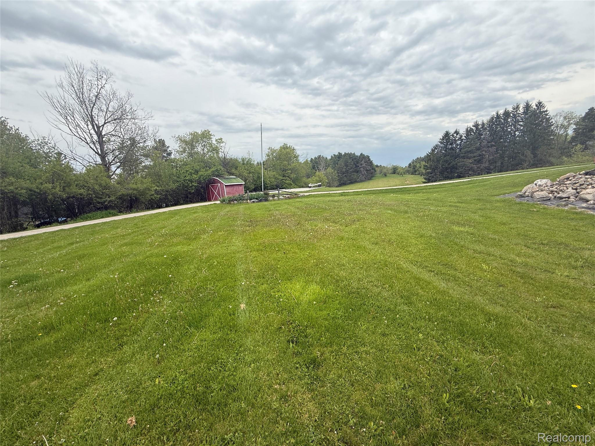 7149-7163 Burpee Road Grand Blanc, MI 48439 - Photo 13 of 72 View of green lawn with a shed