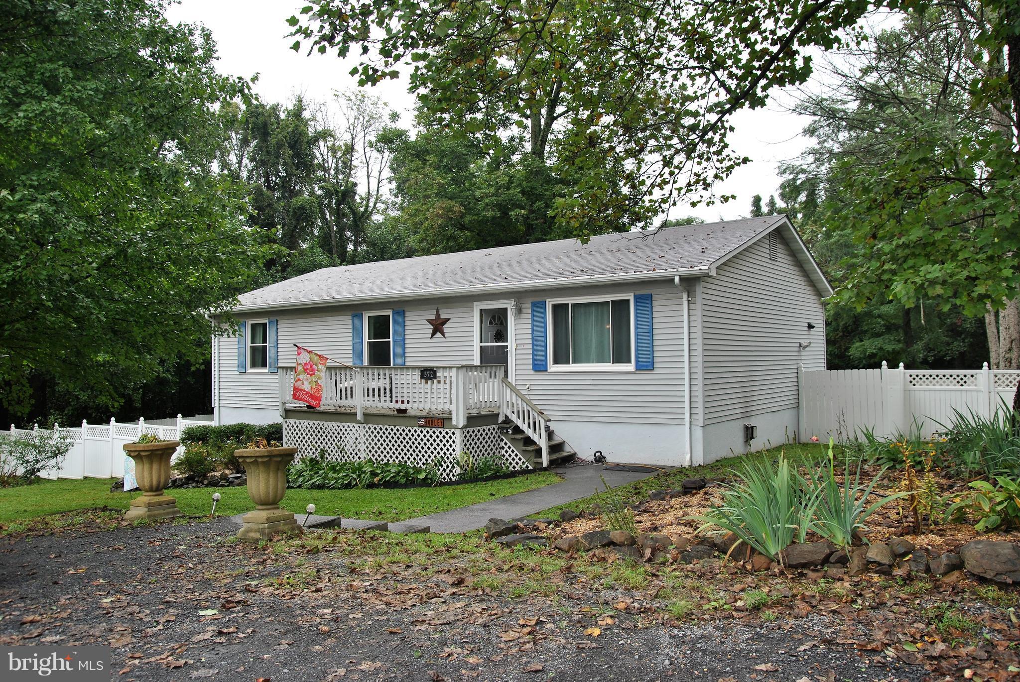 572 Highridge Road Front Royal, VA 22630 - Photo 1 of 26 a view of a house with backyard