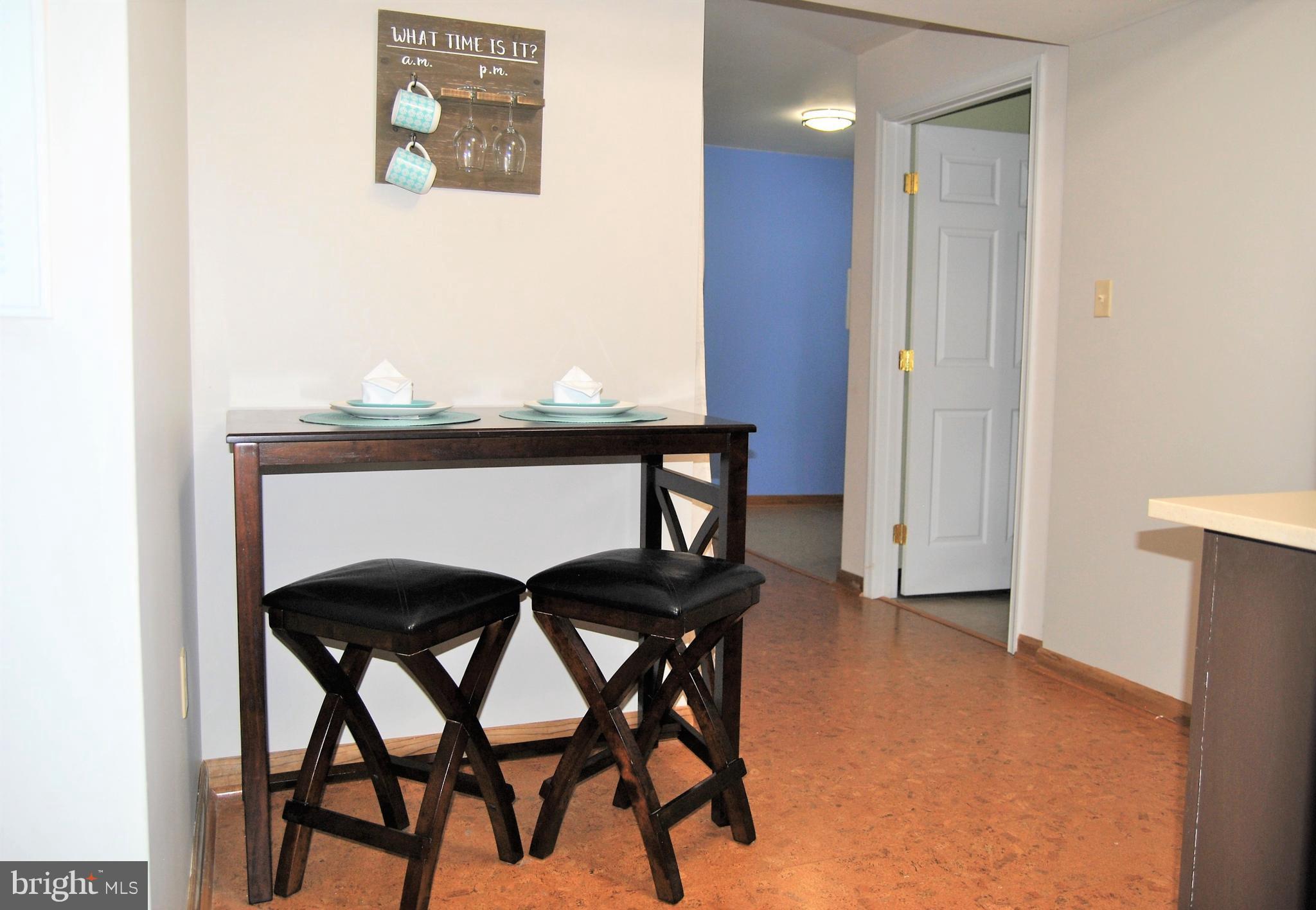 572 Highridge Road Front Royal, VA 22630 - Photo 15 of 26 a view of a dining room with furniture and wooden floor