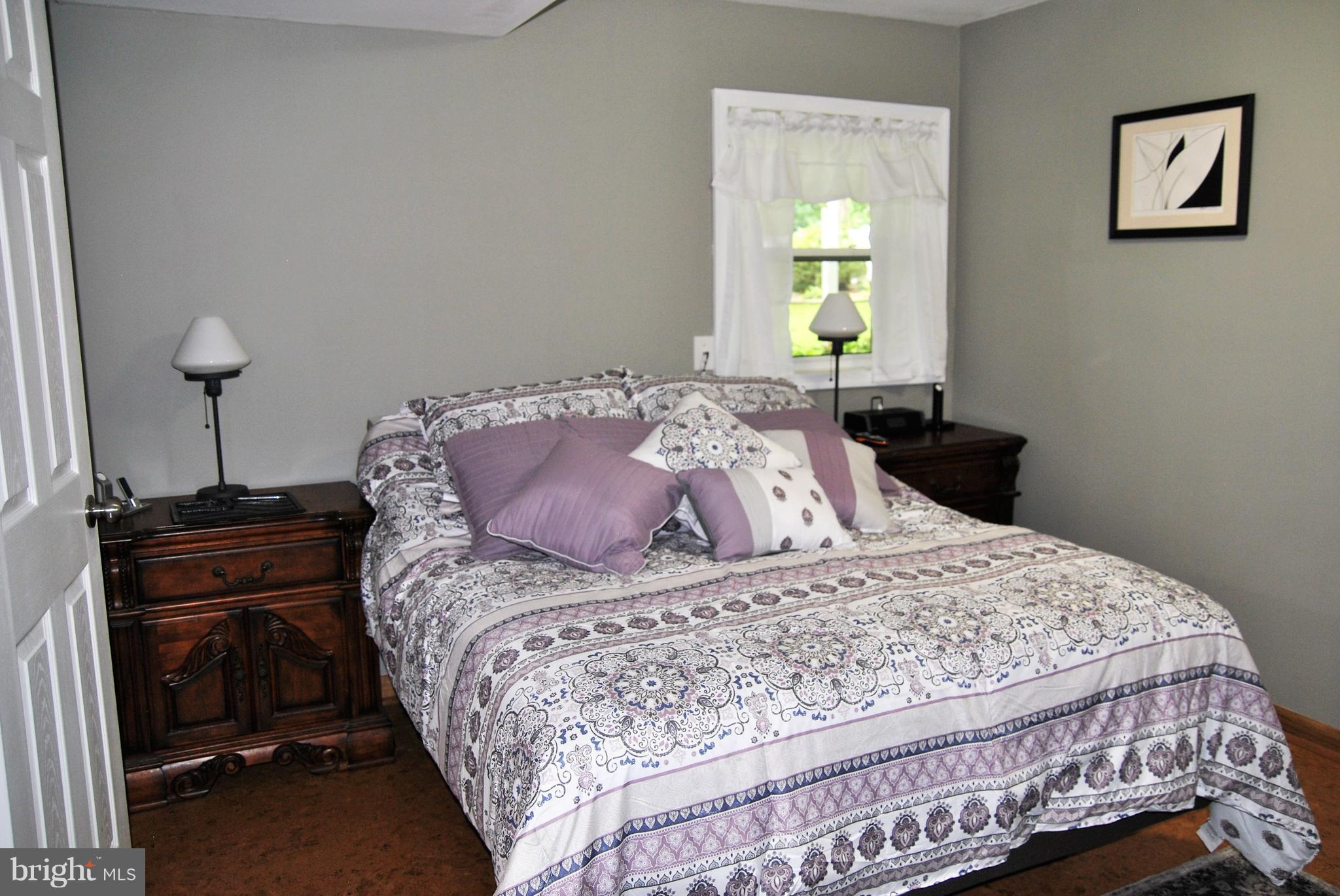 572 Highridge Road Front Royal, VA 22630 - Photo 16 of 26 a bedroom with a bed and a window