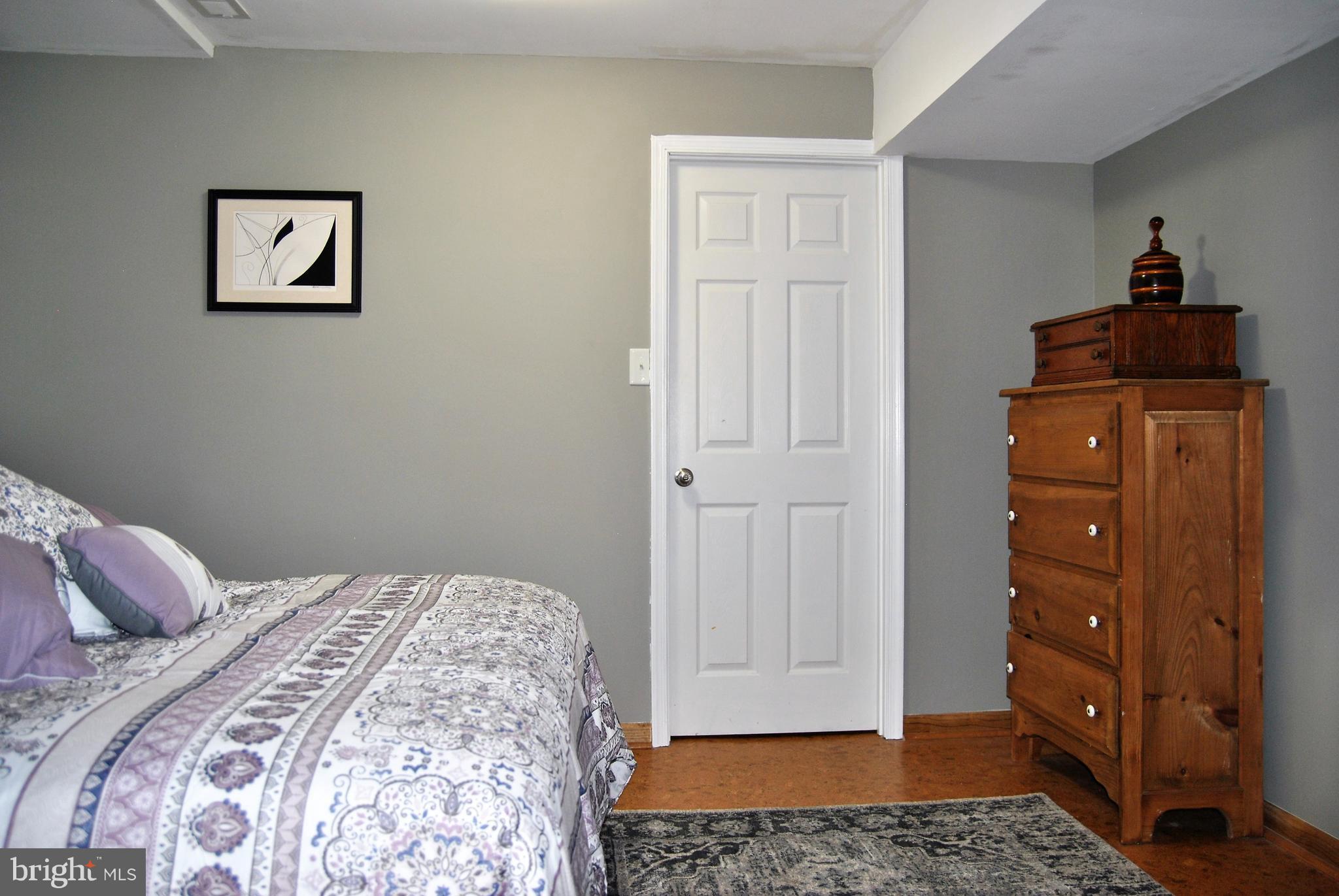 572 Highridge Road Front Royal, VA 22630 - Photo 17 of 26 a bedroom with a bed and a window