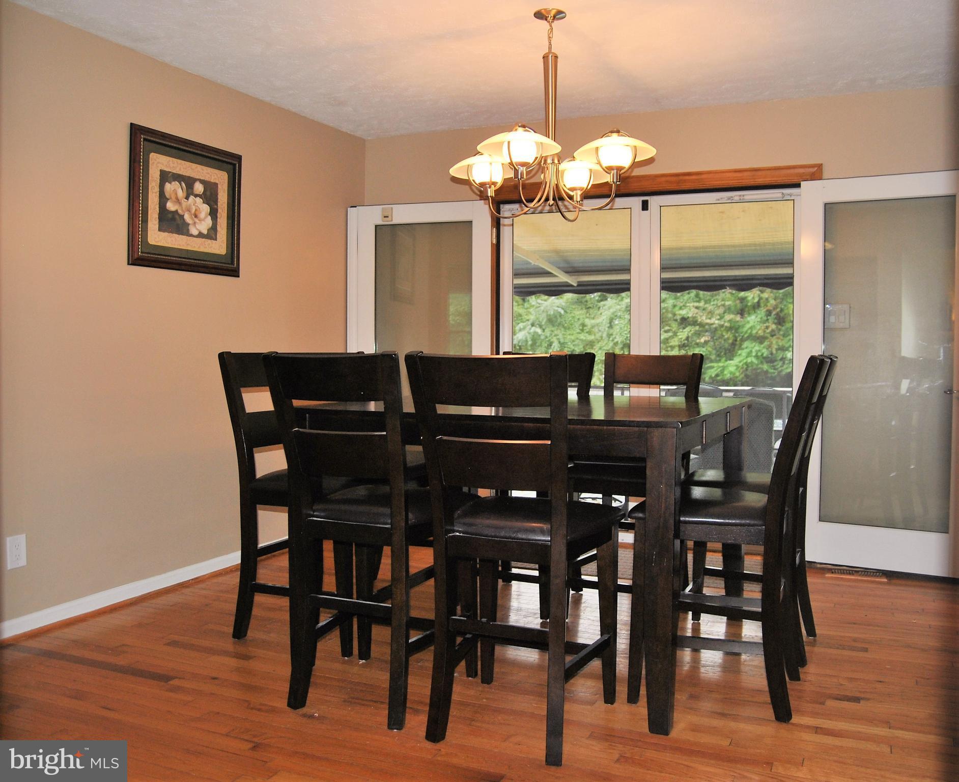 572 Highridge Road Front Royal, VA 22630 - Photo 4 of 26 a view of a dining room with furniture window and wooden floor