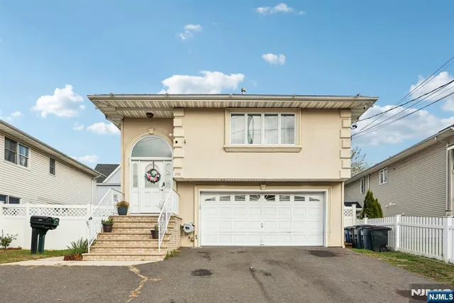 a front view of a house with a garage