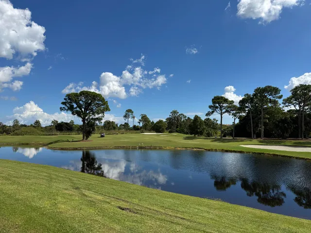 a view of a golf course with a lake