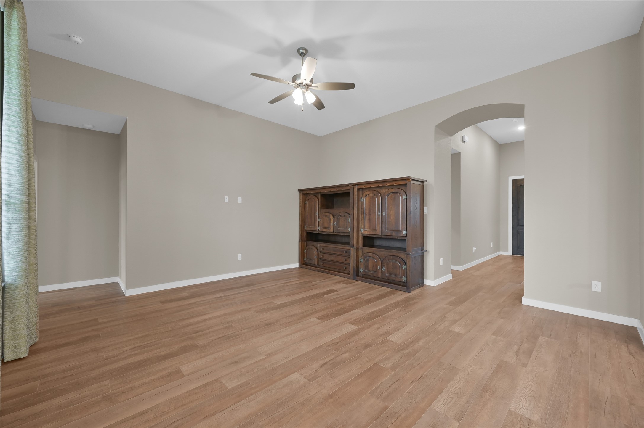 14960 Scarlet Branch Drive Conroe, TX 77302 - Photo 11 of 50 a view of an empty room with wooden floor
