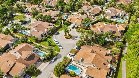 an aerial view of residential houses with outdoor space
