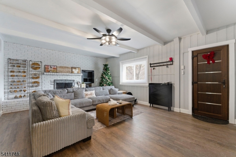 26 Union Road Wantage, NJ 07461 - Photo 1 of 26 a living room with furniture a fireplace and a flat screen tv