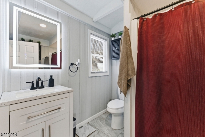 26 Union Road Wantage, NJ 07461 - Photo 16 of 26 a bathroom with a toilet sink and mirror