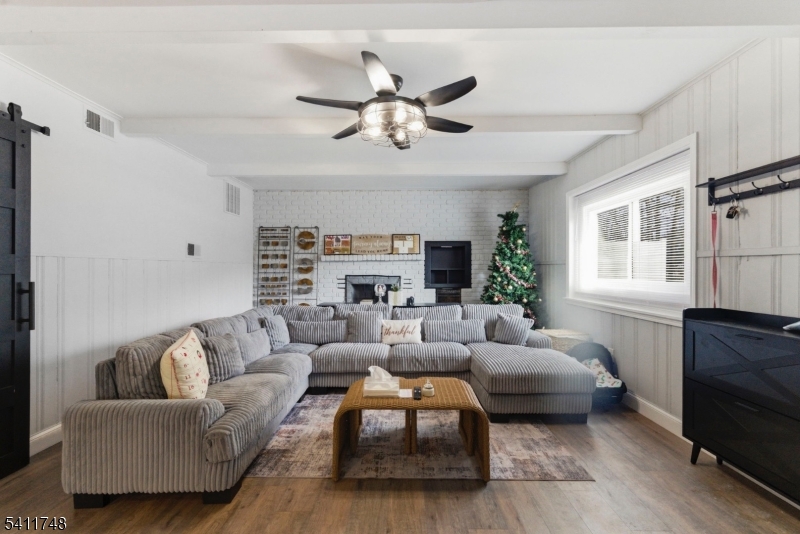 26 Union Road Wantage, NJ 07461 - Photo 3 of 26 a living room with furniture a fireplace and a window