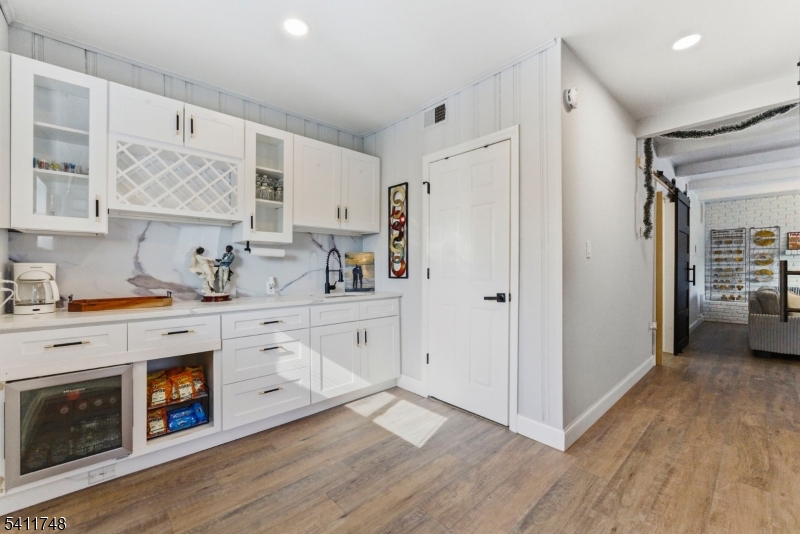 26 Union Road Wantage, NJ 07461 - Photo 6 of 26 a kitchen with stainless steel appliances white cabinets and wooden floors