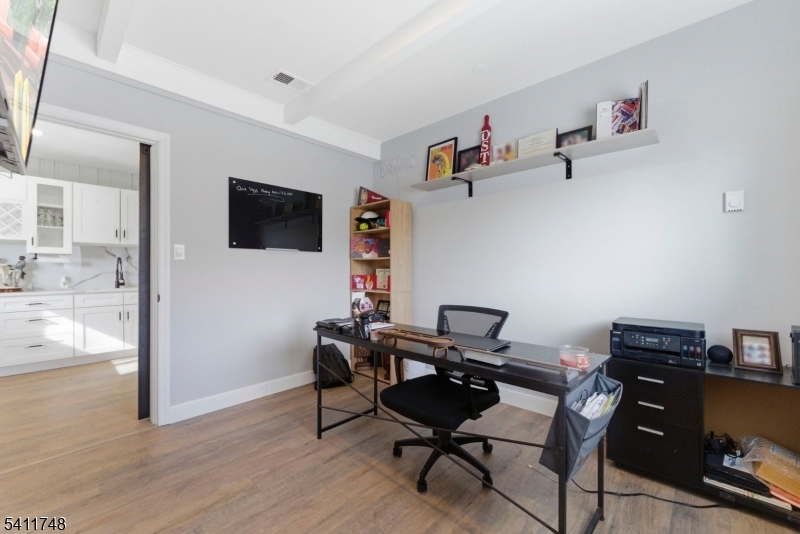 26 Union Road Wantage, NJ 07461 - Photo 7 of 26 a view of a workspace with furniture and a flat screen tv