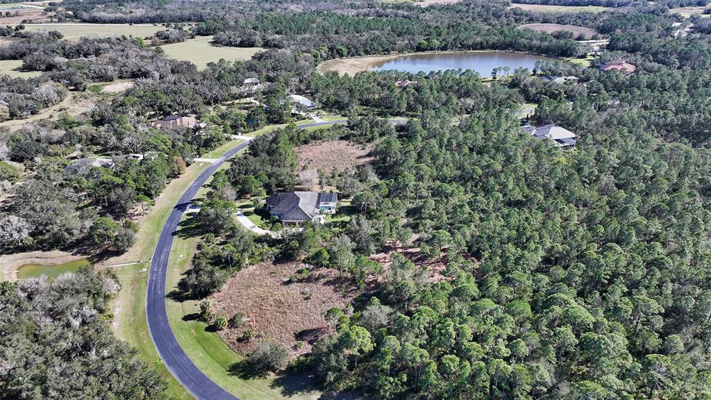 10709 Leafwing Drive Sarasota, FL 34241 - Photo 3 of 27 an aerial view of a house with a yard and outdoor seating