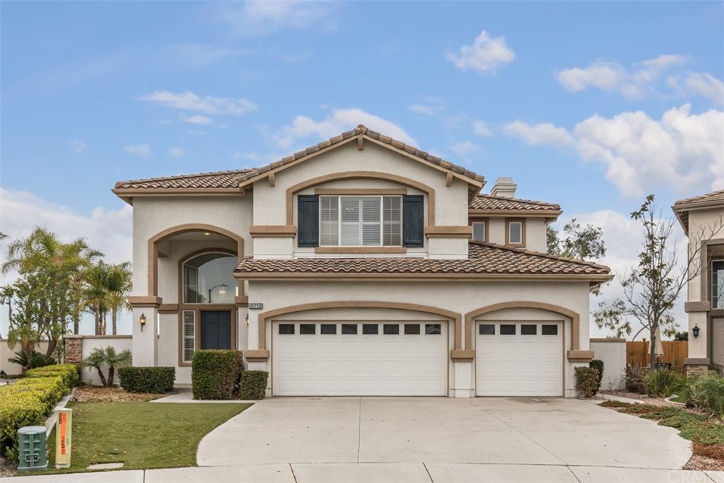 a front view of a house with yard
