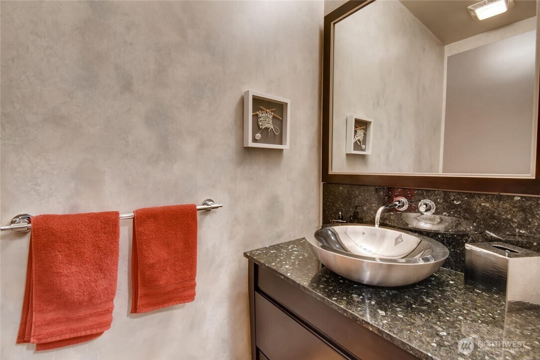 2033 2nd Avenue, Unit 1608 Seattle, WA 98121 - Photo 12 of 33 a bathroom with a granite countertop sink and a mirror