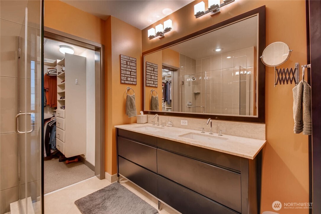 2033 2nd Avenue, Unit 1608 Seattle, WA 98121 - Photo 15 of 33 a bathroom with a sink double vanity and a mirror