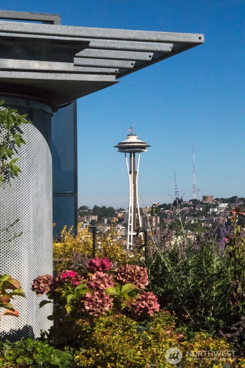 2033 2nd Avenue, Unit 1608 Seattle, WA 98121 - Photo 23 of 33 a front view of a house with a yard