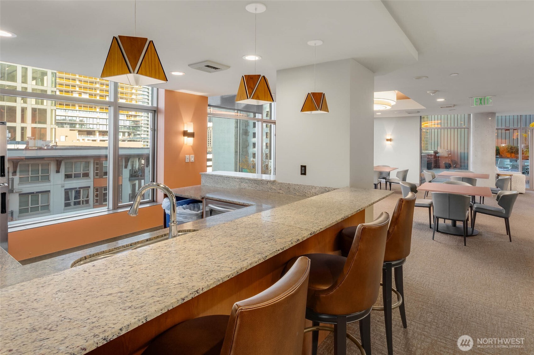 2033 2nd Avenue, Unit 1608 Seattle, WA 98121 - Photo 26 of 33 a kitchen with a table and chairs