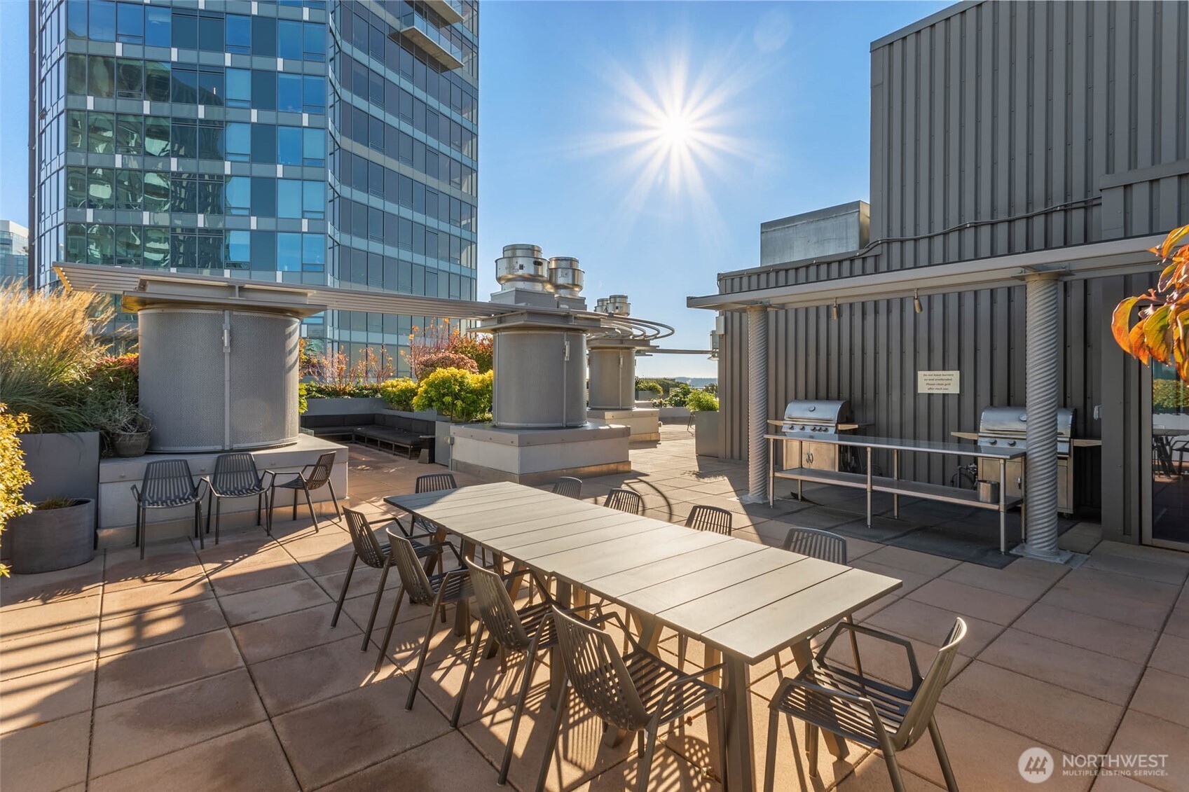2033 2nd Avenue, Unit 1608 Seattle, WA 98121 - Photo 30 of 33 a view of a dinning tables and chairs in patio