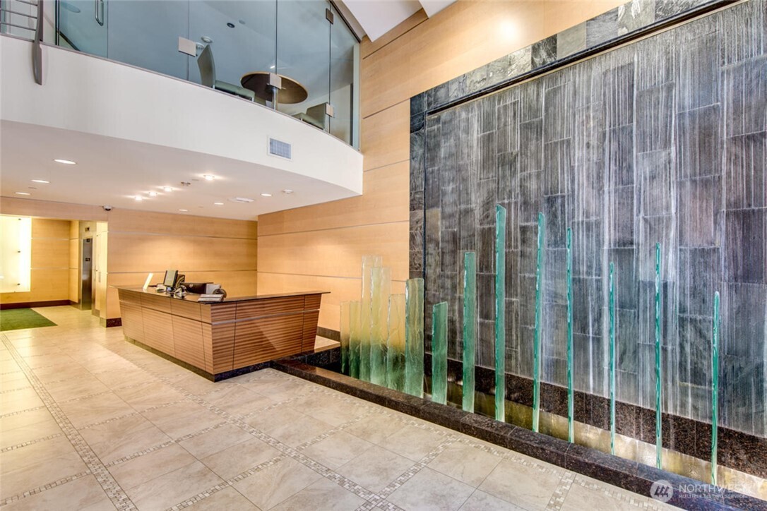 2033 2nd Avenue, Unit 1608 Seattle, WA 98121 - Photo 3 of 33 a large white building with glass door