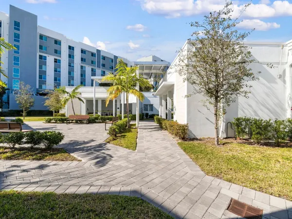 a view of a building with a yard