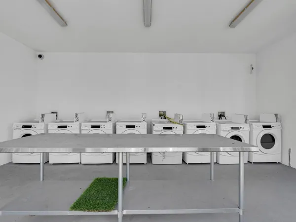 a view of a storage and utility room with washer and dryer