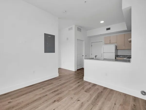 a view of kitchen with wooden floor