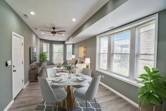 a view of a dining room with furniture window and wooden floor