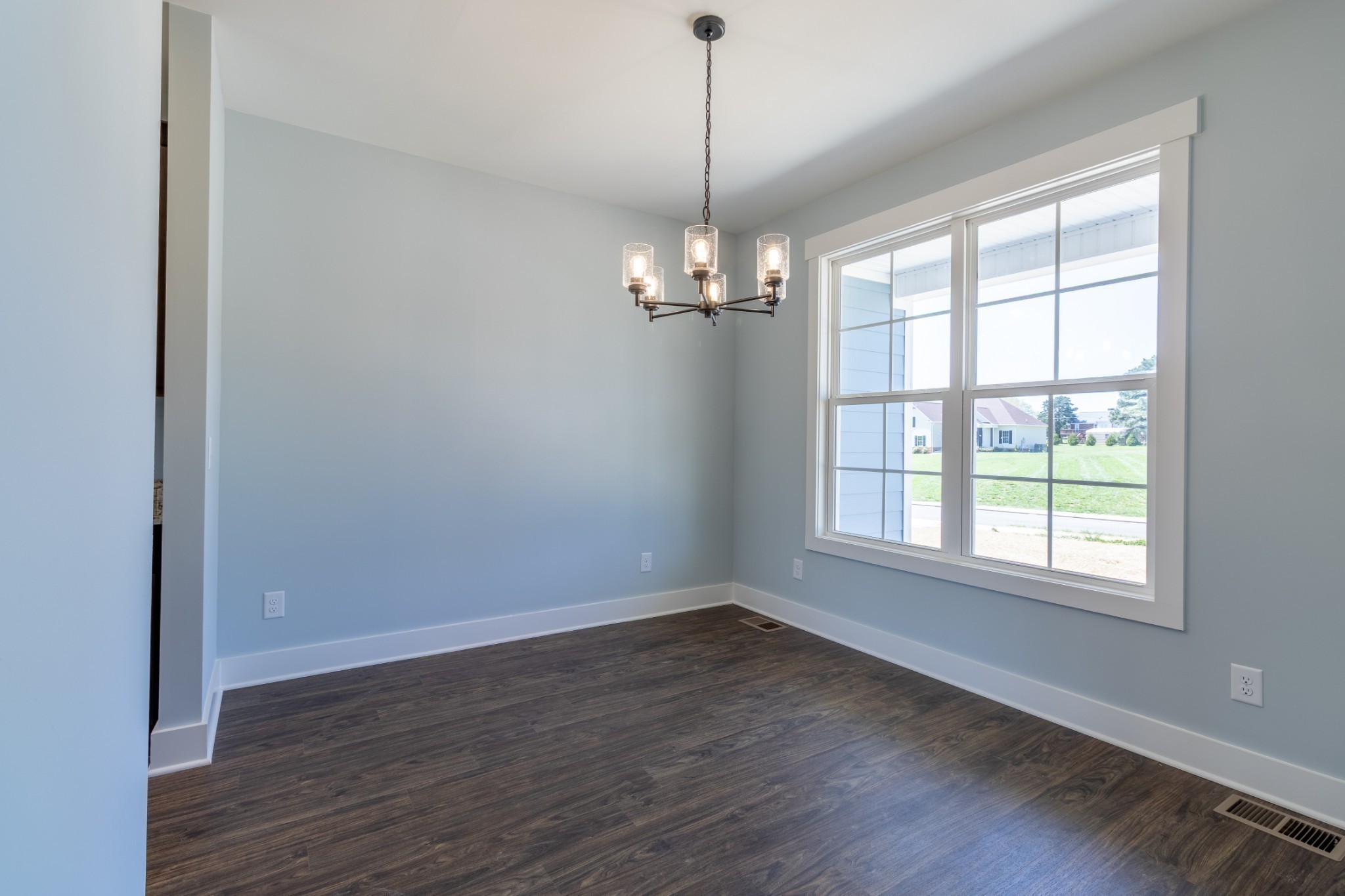 2060 Beverly Court Springfield, TN 37172 - Photo 11 of 33 wooden floor in an empty room with a window