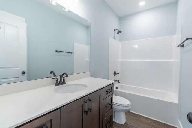 a view of an empty room and closet area