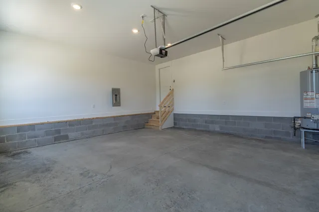 a view of a balcony with wooden floor & fence
