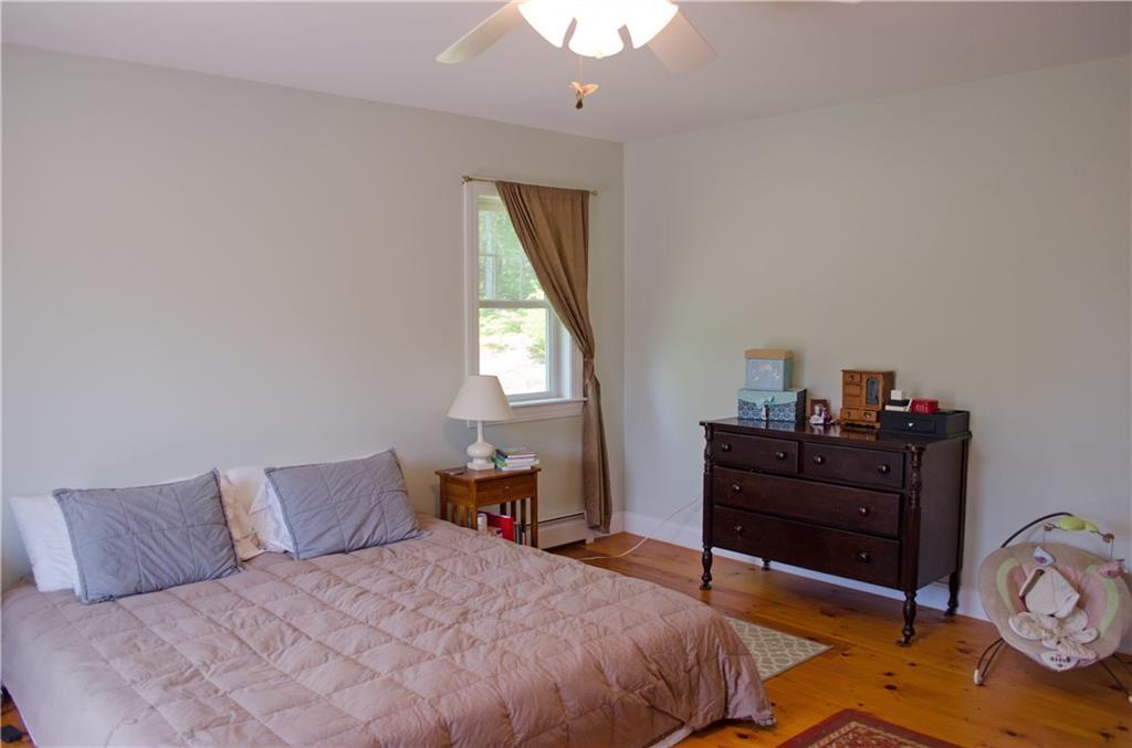 129 Lake Shore Road Holden, ME 04429 - Photo 14 of 29 Large master bedroom with nice wood...