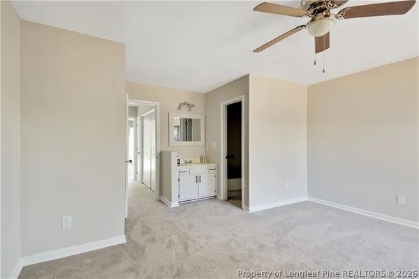 a view of a kitchen with a sink and a refrigerator