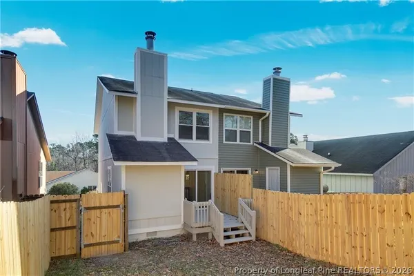 a front view of a house with barbeque grill