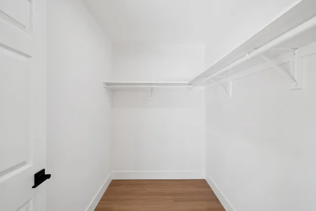 a bed room with a bed and a window